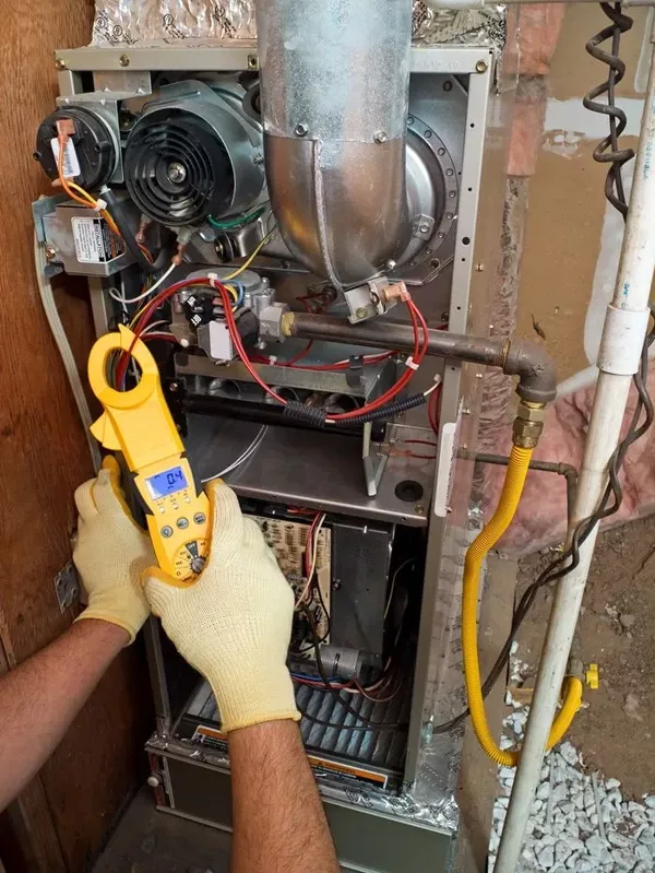 hvac tech testing furnace