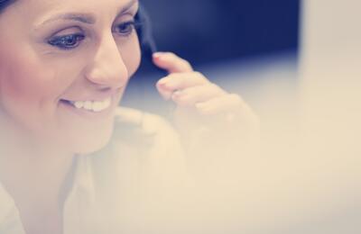 Smiling woman wearing phone headset
