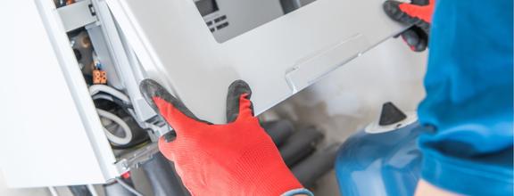 Gloved hands assembling electronic device